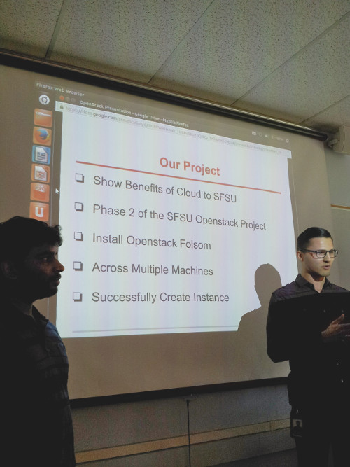 Two students making our project presentation in class